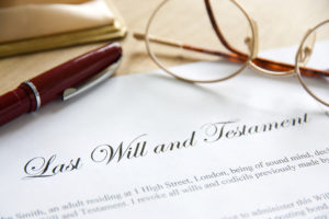 Common Misconceptions About Executors - Last Will and Testament concept image complete with spectacles and pen.